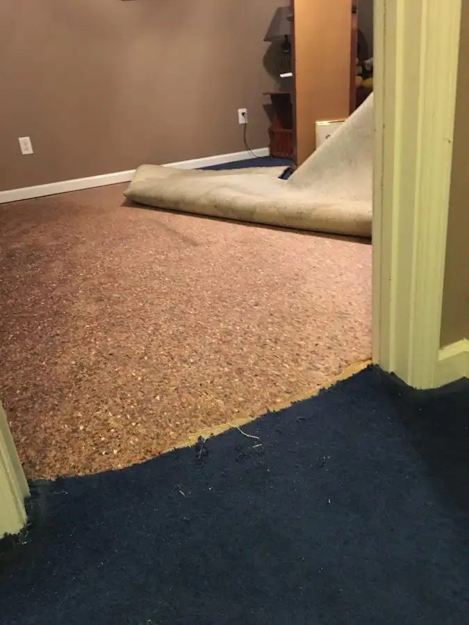Carpet pad removal revealing water damage during Drying & Dehumidification in Ewa Beach